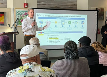 image of a person giving a power point presentation to a class